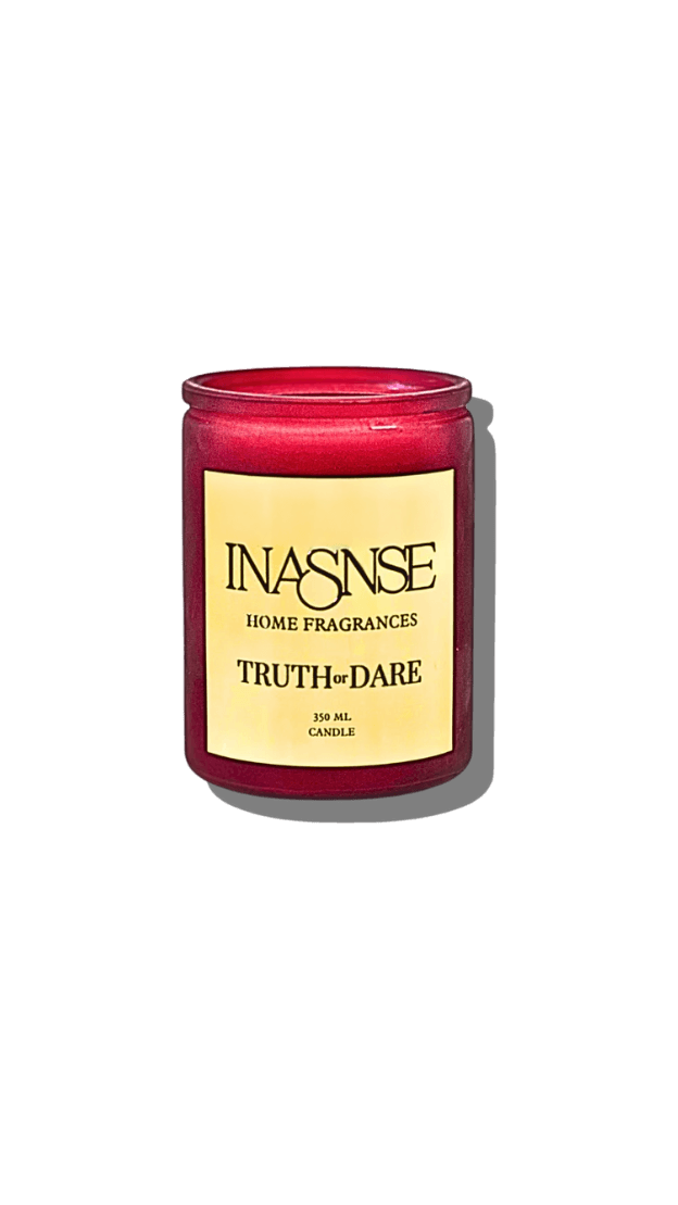 Red truth or dare candle with gold metallic label